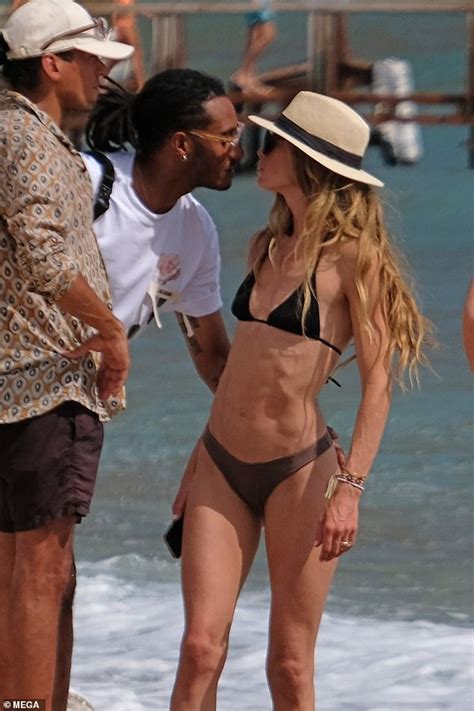 Doutzen Kroes Displays Her Washboard Abs In Black Bikini As She Enjoys