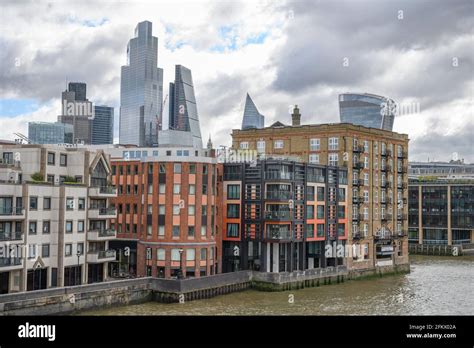 City Of London Skyscrapers Above Waterfront Low Rise Buildings On The