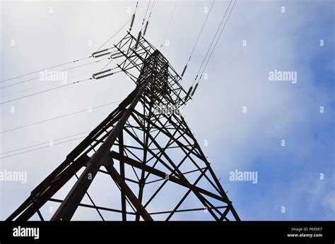 The Silhouette Of The Electricity Transmission Pylon In Daytime