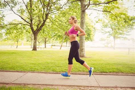 side view  woman jogging premium photo