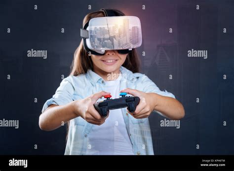 Gay focused girl breaking record in VR game Stock Photo - Alamy