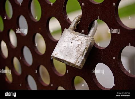 Padlock Placed In A Grate Of Rusty Iron Stock Photo Alamy