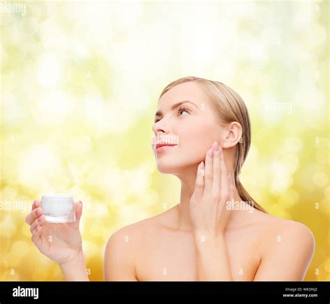 Woman Applying Cream On Her Skin Stock Photo Alamy