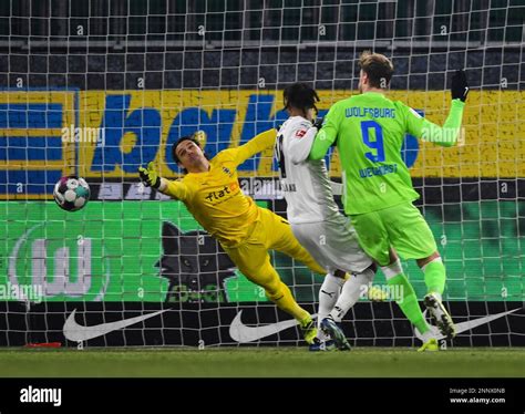 Wolfsburg S Wout Weghorst Right Makes A Shot At Goal As Gladbach S