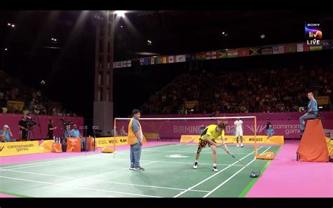 Players On Court As Ng Tze Yong Takes Charge Of Wiping The Court