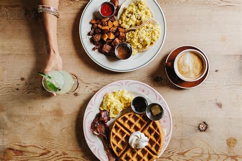 "Two People Having Breakfast At A Cafe" by Stocksy Contributor "Kristen Curette & Daemaine Hines ...