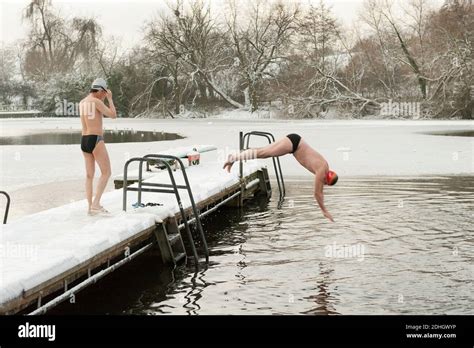 Winter Swimmers Braves The Snow And Ice For Their Daily Swim In Highgate Mens Bathing Pond