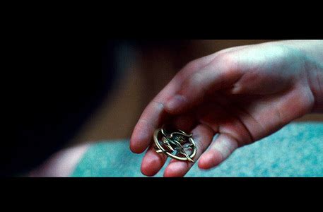 Who gave Katniss the MockingJay pin in the book? - The Hunger Games ...