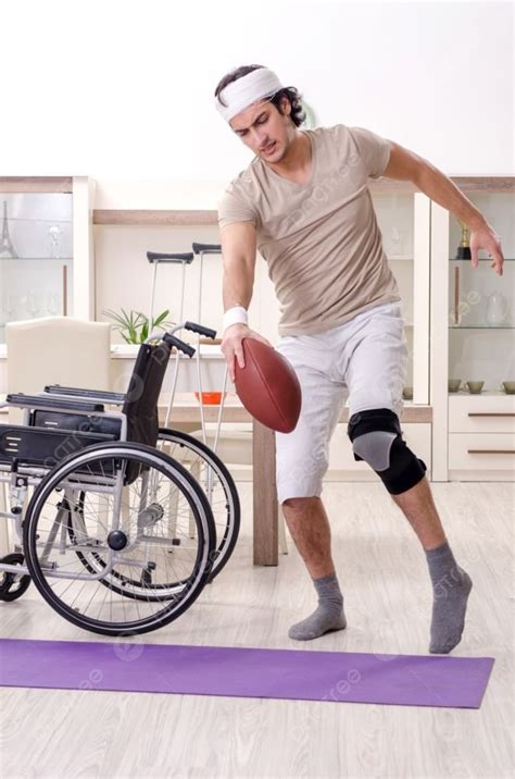 Injured Young Man Doing Exercises At Home Photo Background And Picture ...