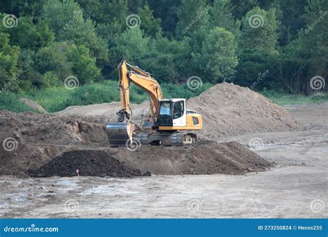 Excavator Surrounded By Granite Rock To Transform Into Gravel Royalty