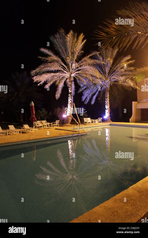 Hotel pool at night Stock Photo - Alamy