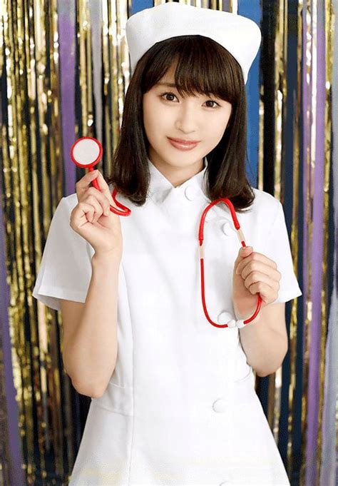 A Woman In A Nurse Outfit Holding Two Red Stethoscopes