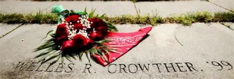 Photo of BC memorial labyrinth with red flowers and red bandanna near Welles R Crowther text