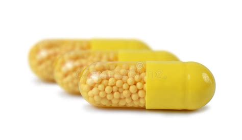 Yellow capsule pills stock photo. Image of closeup, supplement - 84292912