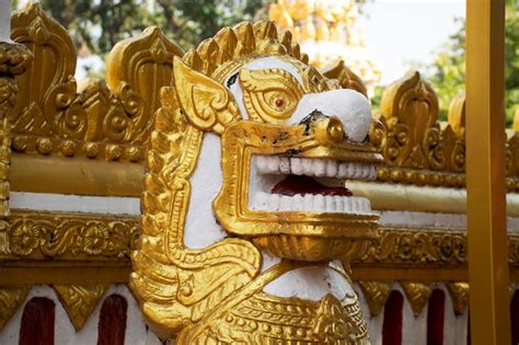 Premium Photo Golden Singha Statue Guardian Of Pagoda Or Stupa Of Wat