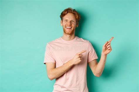 Handsome Male Model With Red Messy Hair Showing Advertisement On Copy