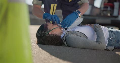 Hands Emergency First Aid And A Paramedic Team With A Patient Or