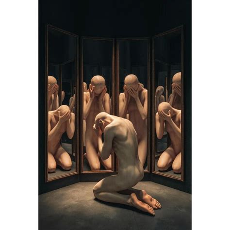 A Man Kneeling In Front Of A Mirror With The Words Naked Men On It