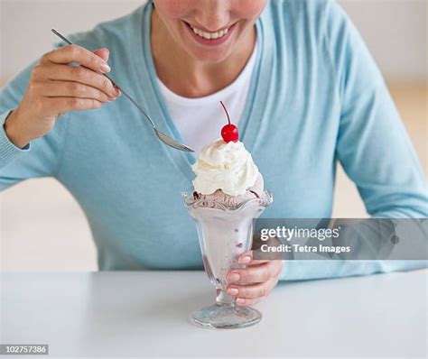 Eating Ice Cream Sundae Photos and Premium High Res Pictures - Getty Images