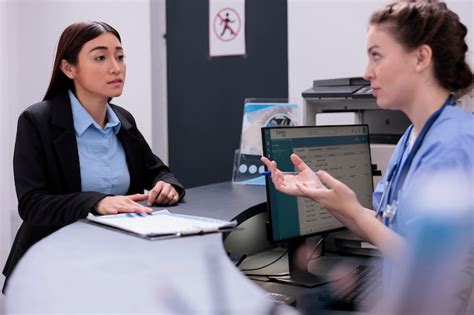 Premium Photo Physician Assistant Talking With Receptionist About Patient Diagnosis Standing