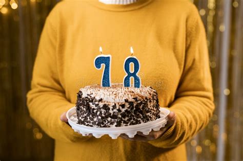 Woman Holding A Festive Cake With Number 78 Candles While Celebrating Birthday Party Birthday