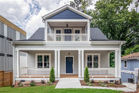 White and Brown Wooden House With Balcony Over A Porch · Free Stock Photo