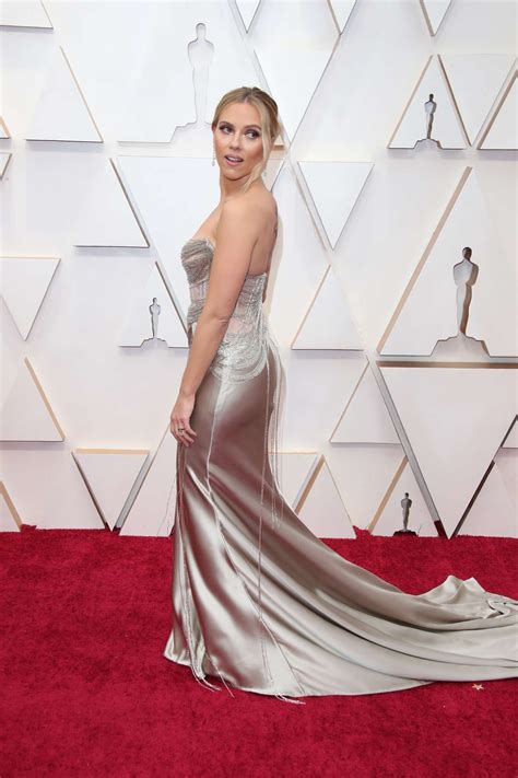 Scarlett Johansson Rocking A Plunging Shiny Silvery Grey Dress With A