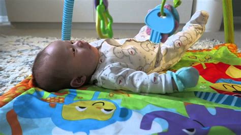 At Two Months Old Baby Rolls Over For The First Time Baby Rolling