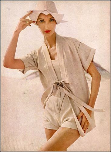 Evelyn Tripp In A Pearly Beige Beach Kimono Worn Over A Square Strapped