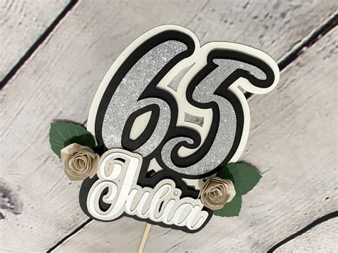 A Cake Topper That Says 65th Birthday With Roses On It And The Number Sixty