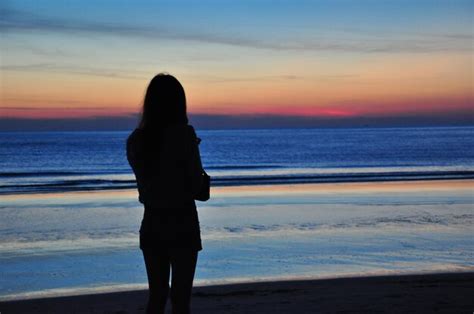 Premium Photo Silhouette Woman Standing At Beach During Sunset