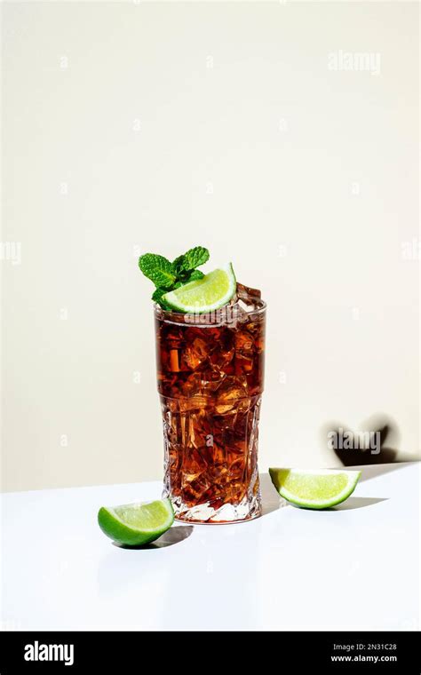 Whiskey Cola Cocktail With Strong Alcohol And Ice Garnished With Mint