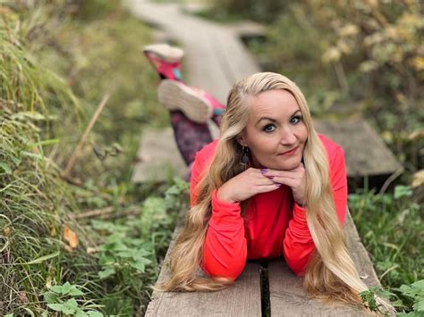 Premium Photo Portrait Of Young Woman Sitting Outdoors