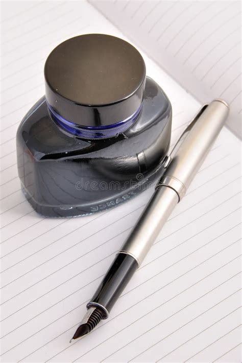 Fountain Pen And Ink Bottle Lying On A Clean Sheet Stock Photo Image