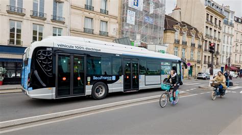 Eco friendly transportation in Paris, with cyclists and a electric bus