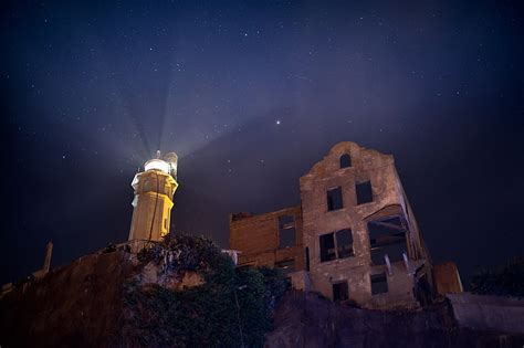 Royalty-Free photo: Brown lighthouse during night time | PickPik