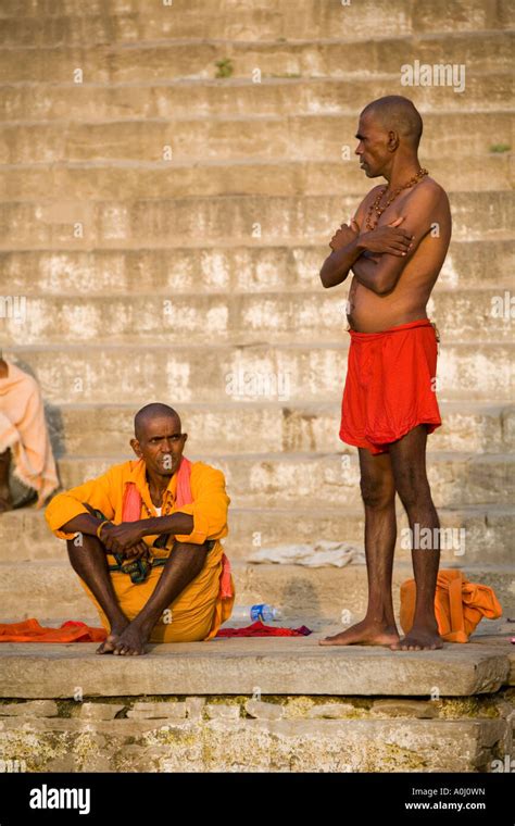 Local Men On The Hindu Ghats On The West Bank Of The River Ganges In