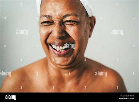 Senior African American Woman Having Fun Wearing Towel On Head At Home