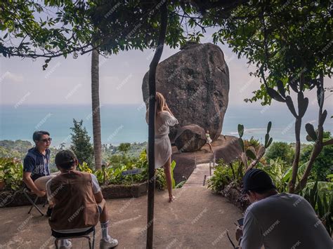 Premium Photo | Tourists take pictures at popular tourist attraction