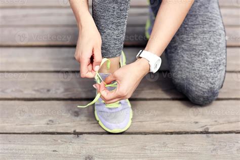 Female Athlete Runner Tying Shoelaces 15896741 Stock Photo At Vecteezy