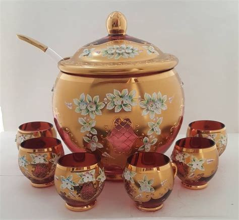 An Ornately Decorated Tea Set With Matching Cups