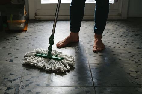 Barefoot Individual Meticulously Cleaning Tiled Floor with Mop Stock ...