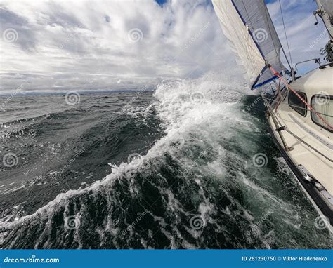 Sailboat Fights Storm And Waves In Open Sea Concept Of Travel