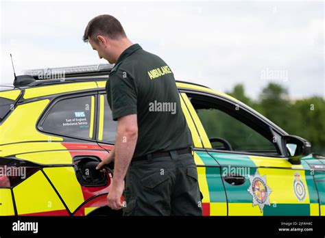 A Paramedic Charges One Of The New Electric Rapid Response Vehicles