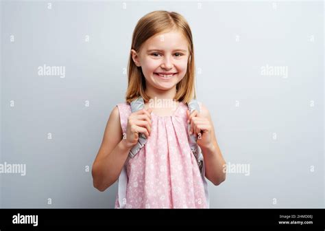 Primary school girl with backpack Stock Photo - Alamy