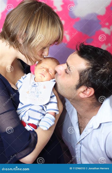 Parents Kissing Newborn Baby Stock Photo Image Of Lifestyle