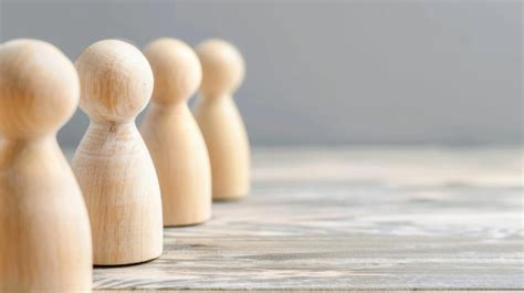 Premium Photo Row Of Wooden Pegs On Table