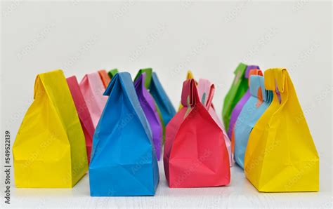 Set of colorful shopping folded paper bags on white background. Paper ...