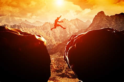 Silhouette Of Man Jumping Between Rock Cliff Artwork Jumping