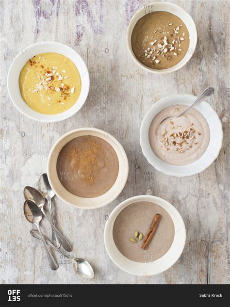 Assorted Puddings Arranged In Bowls From Above Stock Photo Offset